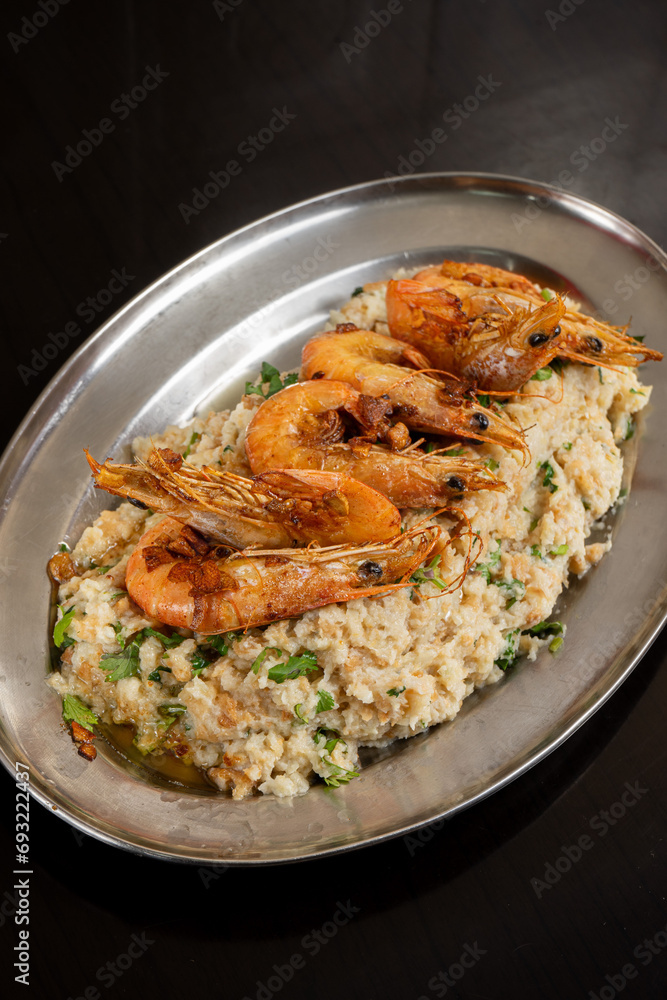 Delicious shrimp açorda served in a restaurant, a traditional Portuguese dish with savory flavors.