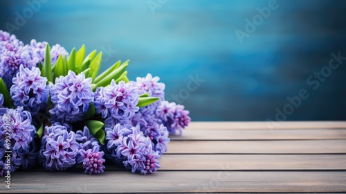 Lilac flowers on a wooden table with space for copy
