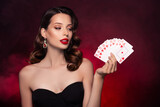 Photo of chic classy lady playing poker look combination card on red effect dark mist background
