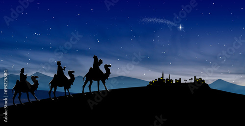 Christmas Nativity Scene - Three Wise Men go to Bethlehem in the desert at night photo