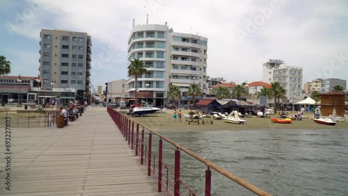 The Larnaca Pier and Larnaca seafront. Panning shot. photo