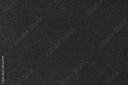 Textile background, black coarse fabric texture, jacquard woven upholstery, furniture textile material, wallpaper, backdrop. Cloth structure close up. photo