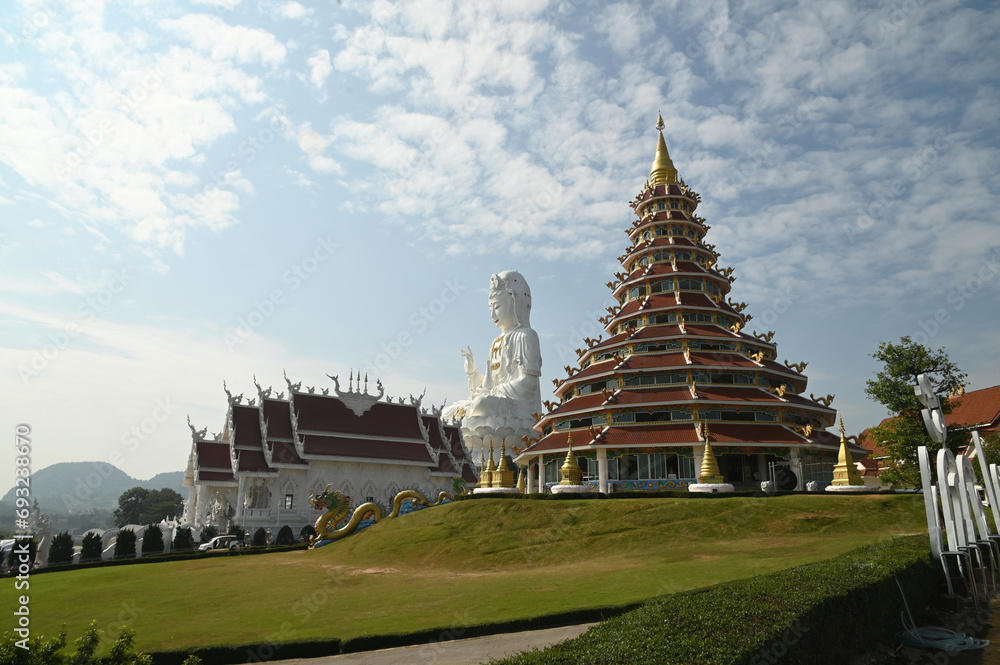 Scene of Guan Yin Bodhisattva Statue The largest Kuan Yin statue in Thailand , chapel and Phop Chok ThamaChedi Phra Maha Chedi. AT Wat Huay Pla Kang temple. Located at Chiang Rai Province in Thailand. Scene of Guan Yin Bodhisattva Statue The largest Kuan Yin statue in Thailand , chapel and Phop Chok ThamaChedi Phra Maha Chedi. AT Wat Huay Pla Kang temple. Located at Chiang Rai Province in Thailand.