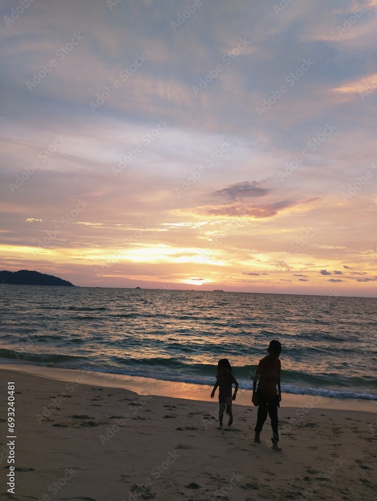 Naklejka premium sunset on the beach