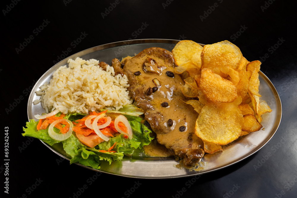 Ταπετσαρία Juicy steak topped with rich coffee sauce in a restaurant setting