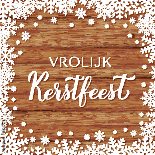 Vrolijk Kerstfeest calligraphy hand lettering on wood background with snowflakes. Merry Christmas typography poster in Dutch. Vector template for greeting card, banner, flyer, etc.