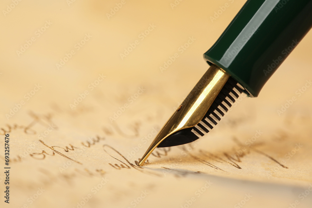 Fototapeta premium Writing letter with beautiful fountain pen, closeup