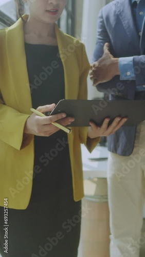 Group of Asian business people working, meeting about business plan and present and explain financial chart.