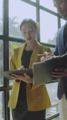 Group of Asian business people working, meeting about business plan and present and explain financial chart.