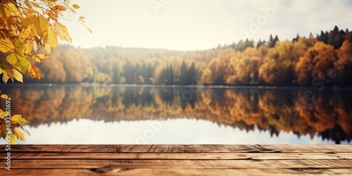 Fall backdrop, close up of aged table on lake with room for text. © Vusal
