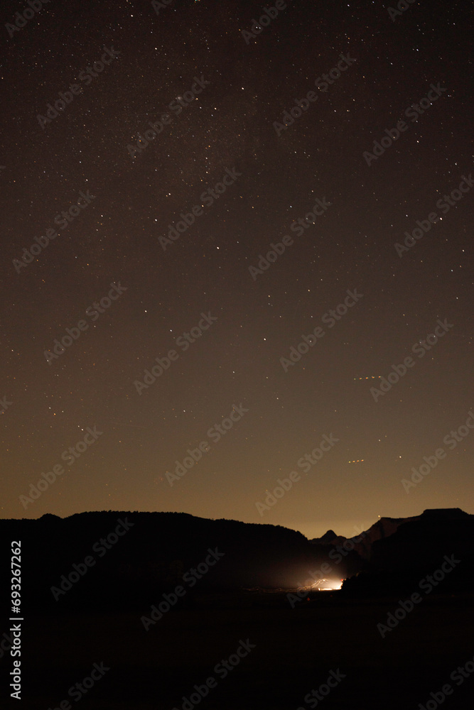 headlights shine from a valley under the stars headlights shine from a valley under the stars