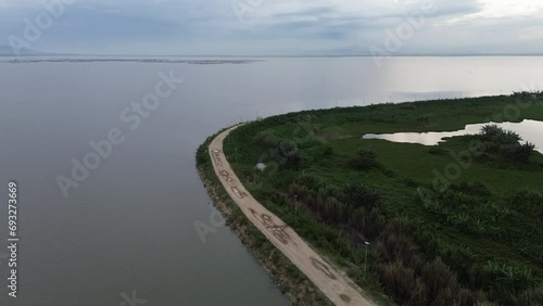 Aerial view of Limboto Lake, and the road in the evening
 photo