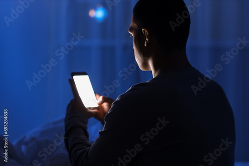Young man using mobile phon...