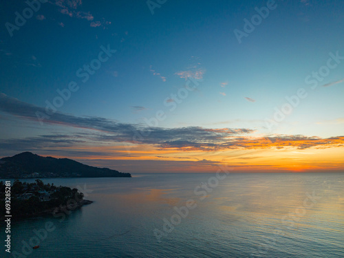 Fototapeta Naklejka Na Ścianę i Meble -  .aerial panorama beautiful sunset at Surin beach Phuket..amazing colorful cloud in beautiful sky at sunset..Scene of Colorful romantic sky sunset with cloud in the sky background..