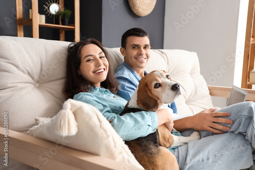 Young couple with cute Beag...