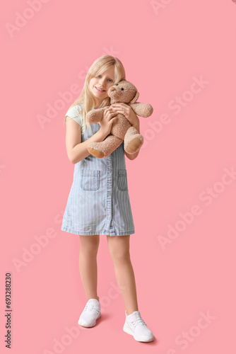 Cute little girl with plush...