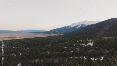 Drone over pine trees approaching Mount Princeton in the Rocky Mountains in Colorado photo