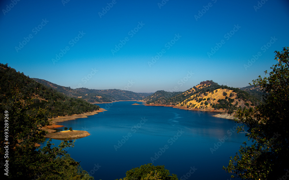 Lake Don Pedro and surrounding mountains with trees