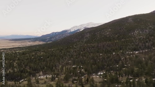 Drone revealing Mount Princeton in the Rocky Mountains in Colorado with pine trees photo
