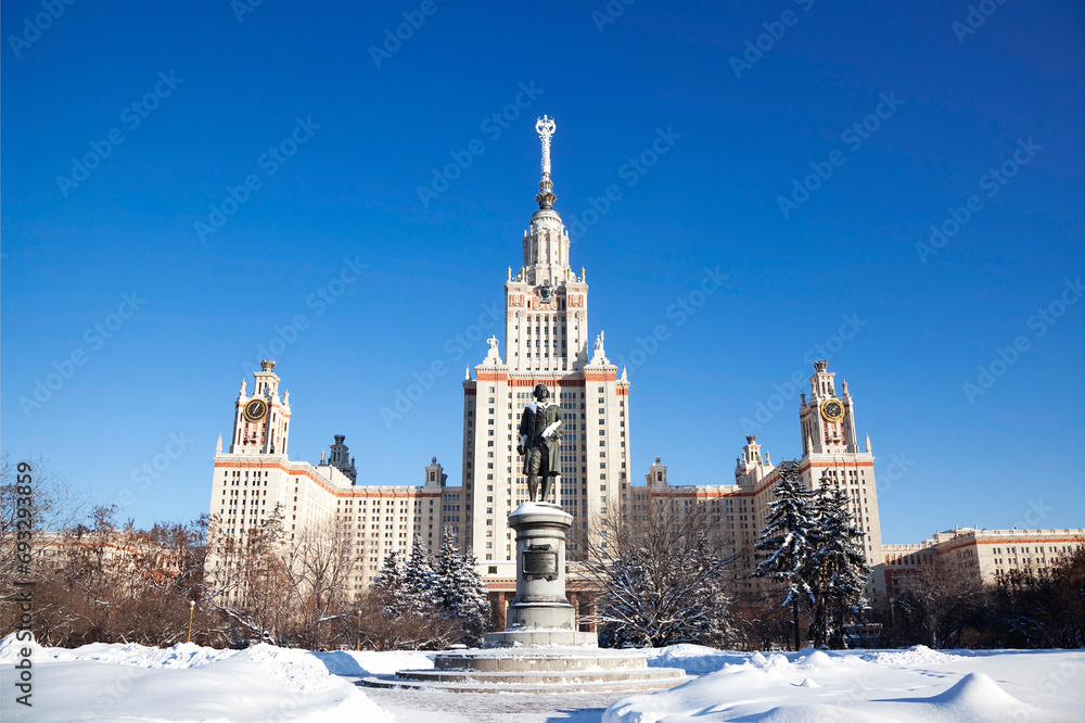 View of the Main building of Lomonosov Moscow State University and the monument to Lomonosov on a sunny winter day. Moscow, Russia