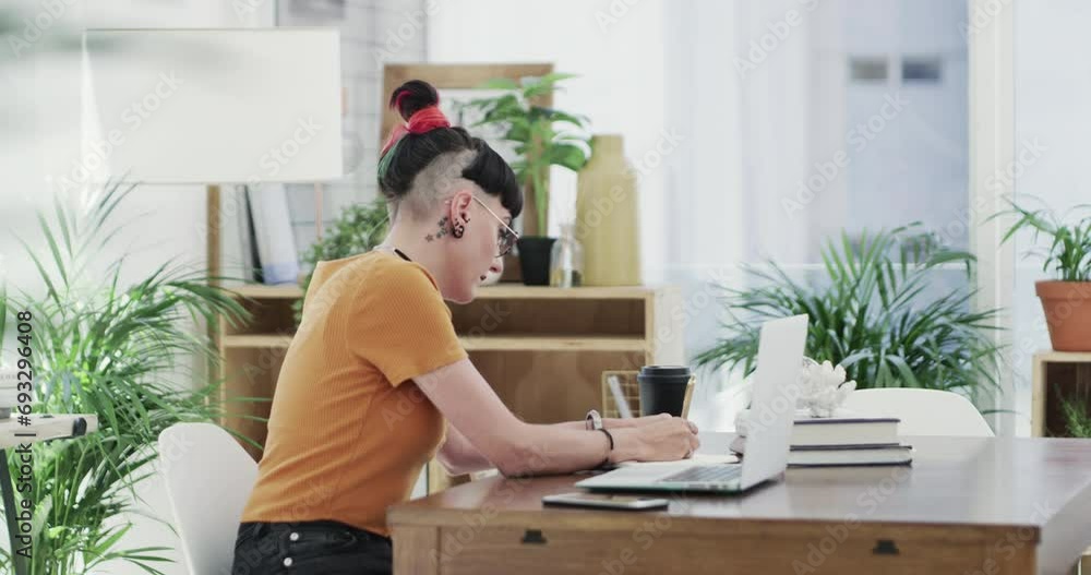 Businesswoman, writing or laptop in modern office, notes or planning project in digital marketing. Young woman, creative or notebook by computer, technology or reading information by website at work Businesswoman, writing or laptop in modern office, notes or planning project in digital marketing. Young woman, creative or notebook by computer, technology or reading information by website at work