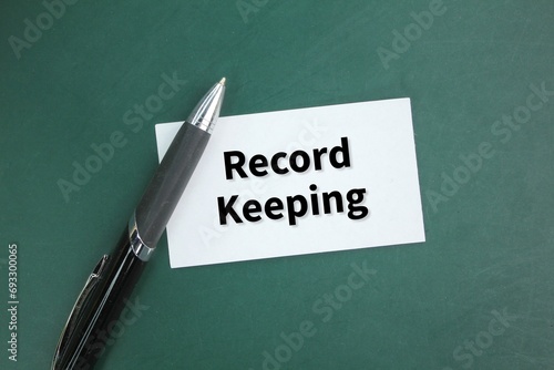 pen and white paper with the words Record keeping. the concept of recorded or keep a record photo