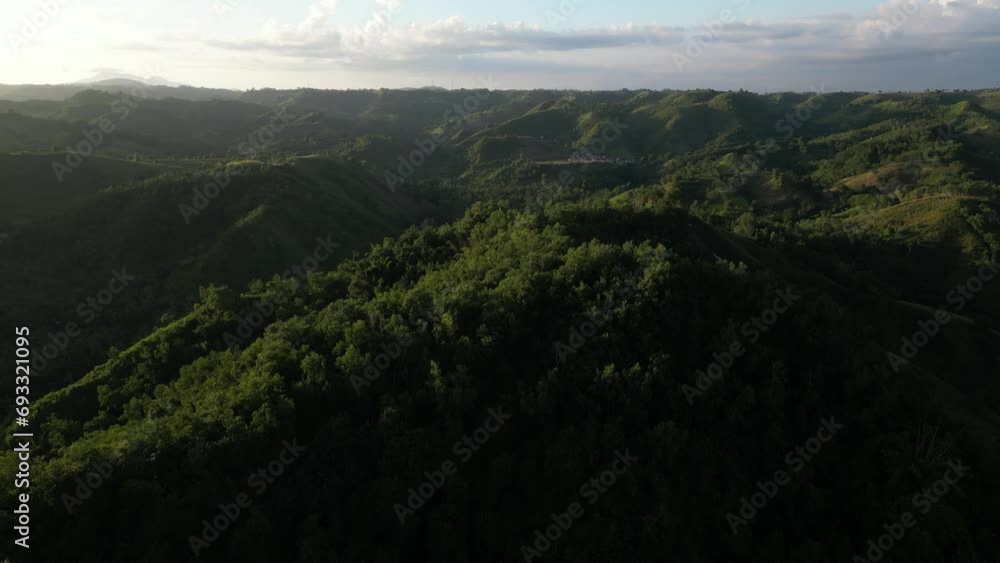 Endless mountain views at sunset in the South of Lombok Island in Indonesia. Aerial. Endless mountain views at sunset in the South of Lombok Island in Indonesia. Aerial.