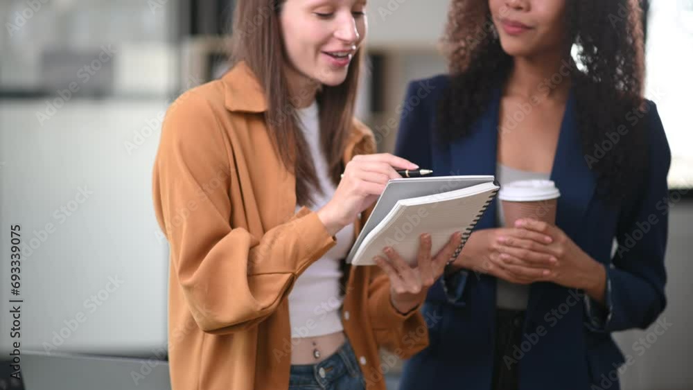 Two business workers talking on the smartphone, tablet and using laptop at office. Two business workers talking on the smartphone, tablet and using laptop at office.