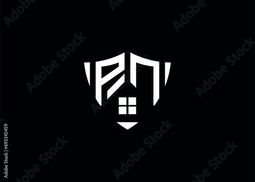 Real estate letter PN shield shape logo and house building vector template 