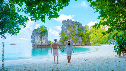Koh Hong Island Krabi Thailand, a couple of men and women on the beach of Koh Hong during a vacation in Thailand photo