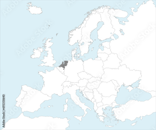 Gray CMYK national map of NETHERLANDS inside detailed white blank political map of European continent on blue background using Mollweide projection