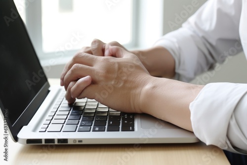 Person typing on a laptop. Suitable for technology or business-related content