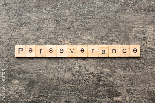 perseverance word written on wood block. perseverance text on table, concept photo