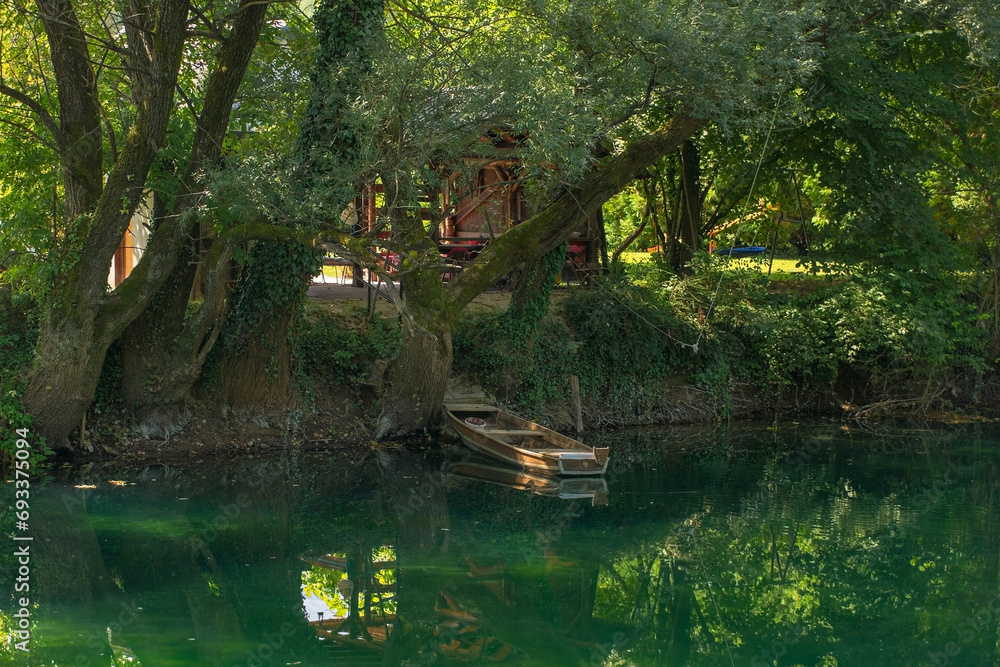 The River Una as it flows through Japod Islands, or Japodski Otoci, near Bihac in the Una National Park. Una-Sana Canton, Federation of Bosnia and Herzegovina The River Una as it flows through Japod Islands, or Japodski Otoci, near Bihac in the Una National Park. Una-Sana Canton, Federation of Bosnia and Herzegovina