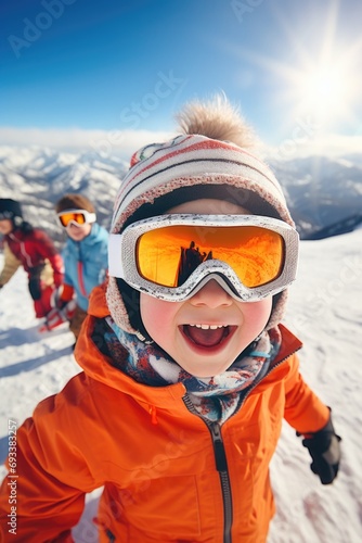 A young child wearing ski goggles on a snowy slope. Perfect for winter sports and outdoor activities