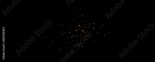 Golden sequins glow with many lights. Glittering dust. Luxurious background of golden particles.