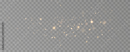 Golden sequins glow with many lights. Glittering dust. Luxurious background of golden particles.