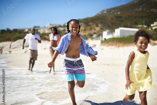 Black family, parents and children or running at beach for adventure, holiday or vacation in summer. African people, face and smile outdoor in nature for break, experience or bonding and relationship