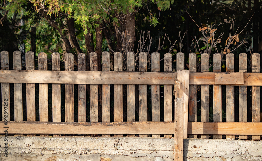 Old gray wooden fence wall of a house Old gray wooden fence wall of a house