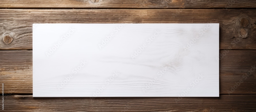 White paper template on textured wood. White paper template on textured wood.