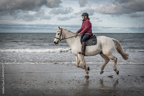 Horse riding on the beach on the Ilse of Anglesey