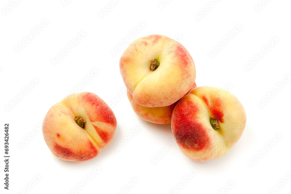 Several saturn peaches or flat peaches isolated on white background with clipping path..