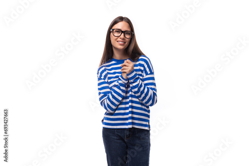 young pretty brunette woman with straight hair wears glasses and a striped sweater