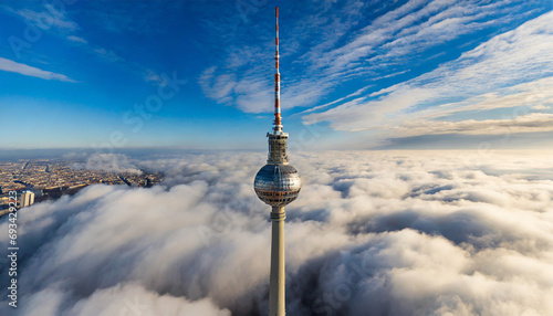 Bird's-eye View of the Television Tower Piercing Through the Clouds in Berlin photo