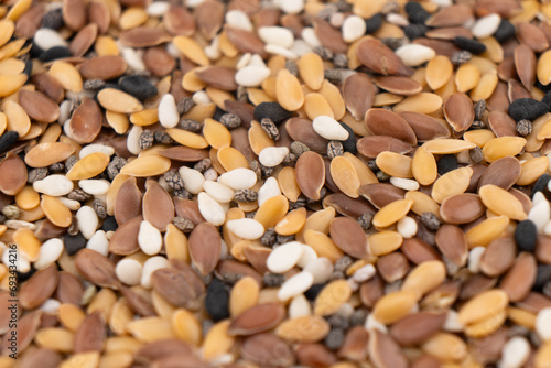 Macro shot of a pile of chia, flax, sesame, and quinoa seeds texture background. Food Background. A scattering of seeds mix. Healthy food. Natural food.