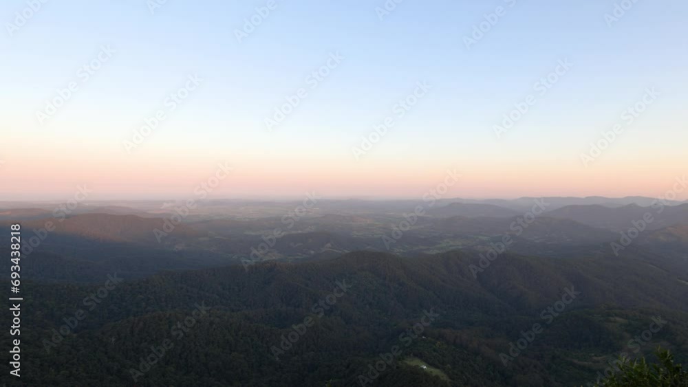 Panoramic sunset views across the Springbrook National Park including a view of Mount Warning in the distance Panoramic sunset views across the Springbrook National Park including a view of Mount Warning in the distance