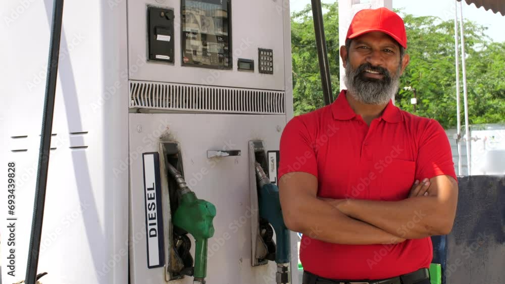 Petrol pump worker at petrol station gas filling station petrol vending machine employment
