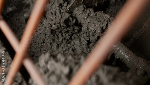 Wallpaper Mural Floor screed mortar. Floor screed with cement mortar. Delivery of the solution. Device for supplying cement mortar. Mixing mortar with crushed stone in an industrial concrete mixer.  Torontodigital.ca