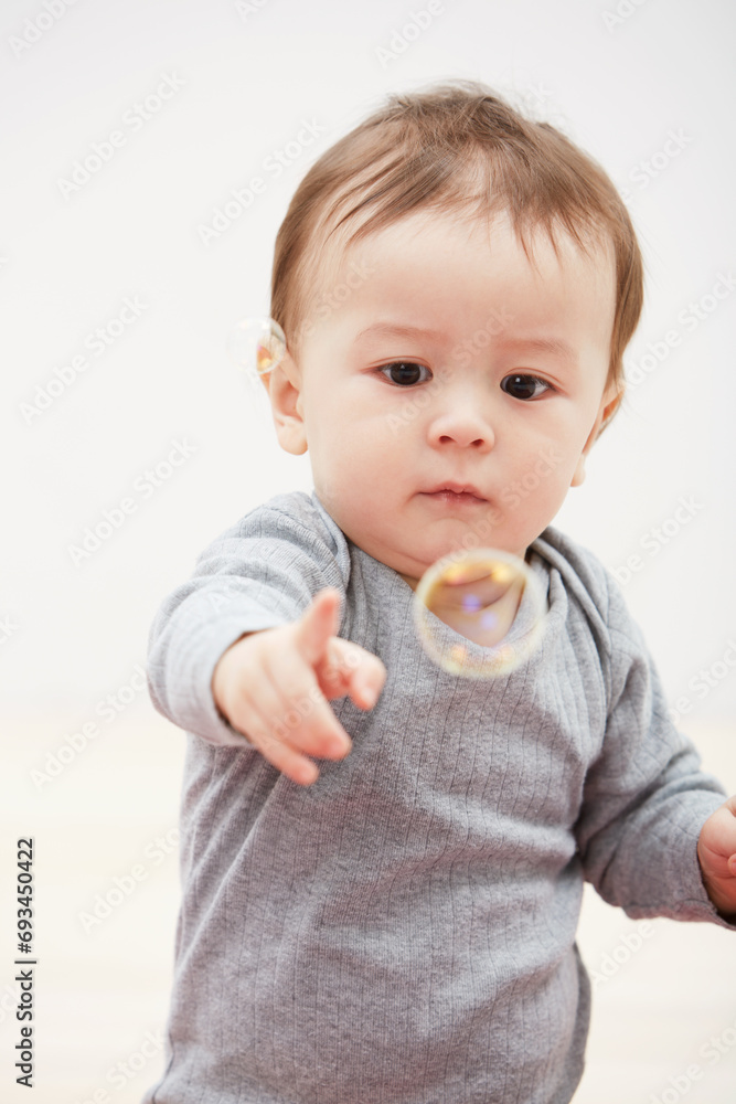 Baby, bubbles and playing game for fun childhood development, curious wondering or education. Kid, growth and mockup space for learning progress or sensory, coordination skill or youth entertainment Baby, bubbles and playing game for fun childhood development, curious wondering or education. Kid, growth and mockup space for learning progress or sensory, coordination skill or youth entertainment