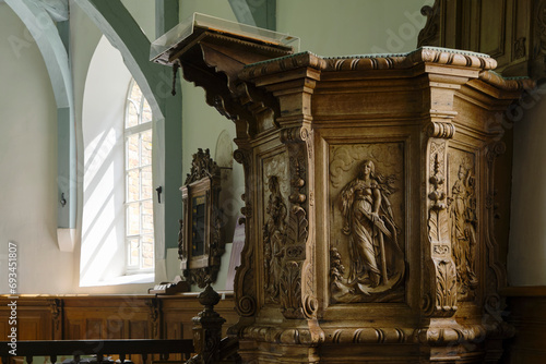 Konstfotografi The wooden pulpit with the seven cardinal virtues from 1759 in the Mariakerk in Beers Friesland The Netherlands